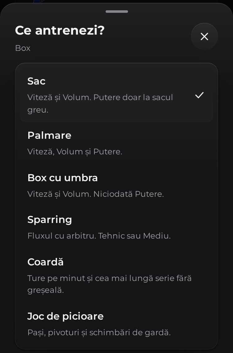 Ecranul pentru tipul sesiunii din aplicația PUMNO, „Ce antrenezi?”: Sac, Palmare, Box cu umbra, Sparring, Coardă și Joc de picioare, fiecare cu o descriere de o linie.